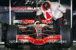 19.07.2007 Nurburg, Germany,  Lewis Hamilton (GBR), McLaren Mercedes gets cleaned by a team member - Formula 1 World Championship, Rd 10, European Grand Prix, Thursday