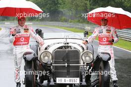 19.07.2007 Nürburg, Germany,  Fernando Alonso (ESP), McLaren Mercedes and Lewis Hamilton (GBR), McLaren Mercedes with a historic Mercedes S from 1927, in the rain - Formula 1 World Championship, Rd 10, European Grand Prix, Thursday