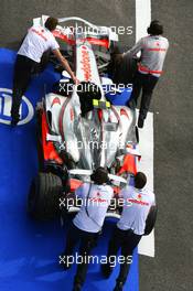 29.06.2007 Magny-Cours, France,  The car of Lewis Hamilton (GBR), McLaren Mercedes is returned to the pitlane after stopping on track - Formula 1 World Championship, Rd 8, French Grand Prix, Friday Practice