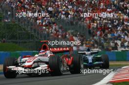 01.07.2007 Magny-Cours, France,  Takuma Sato (JPN), Super Aguri F1, SA07 and Jenson Button (GBR), Honda Racing F1 Team, RA107 - Formula 1 World Championship, Rd 8, French Grand Prix, Sunday Race