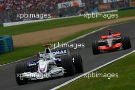 01.07.2007 Magny-Cours, France,  Nick Heidfeld (GER), BMW Sauber F1 Team, F1.07 and Fernando Alonso (ESP), McLaren Mercedes, MP4-22 - Formula 1 World Championship, Rd 8, French Grand Prix, Sunday Race