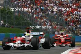 01.07.2007 Magny-Cours, France,  Ralf Schumacher (GER), Toyota Racing, TF107 and Kimi Raikkonen (FIN), Räikkönen, Scuderia Ferrari, F2007 - Formula 1 World Championship, Rd 8, French Grand Prix, Sunday Race
