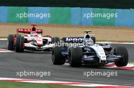 01.07.2007 Magny-Cours, France,  Alexander Wurz (AUT), Williams F1 Team, FW29, Takuma Sato (JPN), Super Aguri F1, SA07 - Formula 1 World Championship, Rd 8, French Grand Prix, Sunday Race