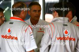 30.06.2007 Magny-Cours, France, Ron Dennis (GBR), McLaren, Team Principal, Chairman and Martin Whitmarsh (GBR), McLaren, Chief Executive Officer, in conversation with other team members after qualifying - Formula 1 World Championship, Rd 8, French Grand Prix, Saturday