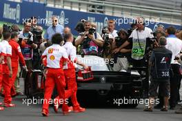 30.06.2007 Magny-Cours, France,  Michael Schumacher (GER), Scuderia Ferrari, in a Ferrari FXX with Zinedine Zidane - Formula 1 World Championship, Rd 8, French Grand Prix, Saturday