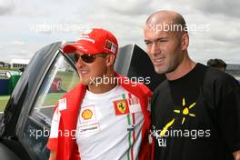 30.06.2007 Magny-Cours, France,  Michael Schumacher (GER), Scuderia Ferrari, Advisor and Zinedine Zidane (FRA) - Formula 1 World Championship, Rd 8, French Grand Prix, Saturday