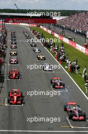 08.07.2007 Silverstone, England,  Cars start the formation lap, Lewis Hamilton (GBR), McLaren Mercedes, MP4-22, Kimi Raikkonen (FIN), Räikkönen, Scuderia Ferrari, F2007, Fernando Alonso (ESP), McLaren Mercedes, MP4-22 - Formula 1 World Championship, Rd 9, British Grand Prix, Sunday Pre-Race Grid