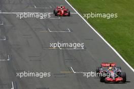 08.07.2007 Silverstone, England,  Lewis Hamilton (GBR), McLaren Mercedes, MP4-22 and Kimi Raikkonen (FIN), Räikkönen, Scuderia Ferrari, F2007 - Formula 1 World Championship, Rd 9, British Grand Prix, Sunday Race