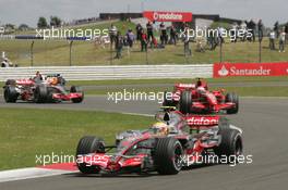 08.07.2007 Silverstone, England,  Lewis Hamilton (GBR), McLaren Mercedes, MP4-22, Kimi Raikkonen (FIN), Räikkönen, Scuderia Ferrari, F2007 and Fernando Alonso (ESP), McLaren Mercedes, MP4-22 - Formula 1 World Championship, Rd 9, British Grand Prix, Sunday Race