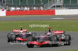 08.07.2007 Silverstone, England,  Fernando Alonso (ESP), McLaren Mercedes, MP4-22 and Lewis Hamilton (GBR), McLaren Mercedes, MP4-22 - Formula 1 World Championship, Rd 9, British Grand Prix, Sunday Race