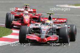 08.07.2007 Silverstone, England,  Lewis Hamilton (GBR), McLaren Mercedes, MP4-22 and Kimi Raikkonen (FIN), Räikkönen, Scuderia Ferrari, F2007 - Formula 1 World Championship, Rd 9, British Grand Prix, Sunday Race