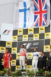 05.08.2007 Budapest, Hungary,  2nd place Kimi Raikkonen (FIN), Räikkönen, Scuderia Ferrari with 2nd place  Lewis Hamilton (GBR), McLaren Mercedes and 3rd place Nick Heidfeld (GER), BMW Sauber F1 Team - Formula 1 World Championship, Rd 11, Hungarian Grand Prix, Sunday Podium