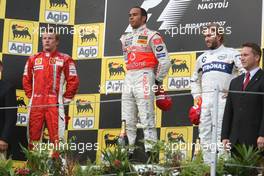 05.08.2007 Budapest, Hungary,  2nd place Kimi Raikkonen (FIN), Räikkönen, Scuderia Ferrari with 2nd place  Lewis Hamilton (GBR), McLaren Mercedes and 3rd place Nick Heidfeld (GER), BMW Sauber F1 Team - Formula 1 World Championship, Rd 11, Hungarian Grand Prix, Sunday Podium