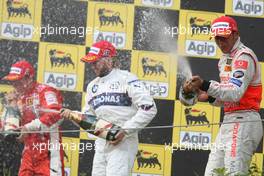 05.08.2007 Budapest, Hungary,  2nd place Kimi Raikkonen (FIN), Räikkönen, Scuderia Ferrari with 1st place  Lewis Hamilton (GBR), McLaren Mercedes and 3rd place Nick Heidfeld (GER), BMW Sauber F1 Team - Formula 1 World Championship, Rd 11, Hungarian Grand Prix, Sunday Podium