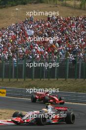 05.08.2007 Budapest, Hungary,  Lewis Hamilton (GBR), McLaren Mercedes, MP4-22 and Kimi Raikkonen (FIN), Räikkönen, Scuderia Ferrari, F2007 - Formula 1 World Championship, Rd 11, Hungarian Grand Prix, Sunday Race