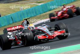 05.08.2007 Budapest, Hungary,  Lewis Hamilton (GBR), McLaren Mercedes, MP4-22 and Kimi Raikkonen (FIN), Räikkönen, Scuderia Ferrari, F2007 - Formula 1 World Championship, Rd 11, Hungarian Grand Prix, Sunday Race