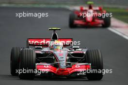 05.08.2007 Budapest, Hungary,  Lewis Hamilton (GBR), McLaren Mercedes, MP4-22 and Kimi Raikkonen (FIN), Räikkönen, Scuderia Ferrari, F2007 - Formula 1 World Championship, Rd 11, Hungarian Grand Prix, Sunday Race