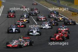 05.08.2007 Budapest, Hungary,  Start, Lewis Hamilton (GBR), McLaren Mercedes, MP4-22 leads Kimi Raikkonen (FIN), Räikkönen, Scuderia Ferrari, F2007 and Nick Heidfeld (GER), BMW Sauber F1 Team, F1.07 - Formula 1 World Championship, Rd 11, Hungarian Grand Prix, Sunday Race