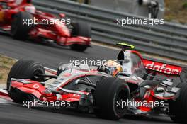 05.08.2007 Budapest, Hungary,  Lewis Hamilton (GBR), McLaren Mercedes, MP4-22 and Kimi Raikkonen (FIN), Räikkönen, Scuderia Ferrari, F2007 - Formula 1 World Championship, Rd 11, Hungarian Grand Prix, Sunday Race