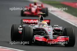 05.08.2007 Budapest, Hungary,  Lewis Hamilton (GBR), McLaren Mercedes, MP4-22 and Kimi Raikkonen (FIN), Räikkönen, Scuderia Ferrari, F2007 - Formula 1 World Championship, Rd 11, Hungarian Grand Prix, Sunday Race