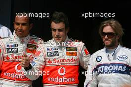 04.08.2007 Budapest, Hungary,  Lewis Hamilton (GBR), McLaren Mercedes with pole postion man Fernando Alonso (ESP), McLaren Mercedes and Nick Heidfeld (GER), BMW Sauber F1 Team - Formula 1 World Championship, Rd 11, Hungarian Grand Prix, Saturday Qualifying