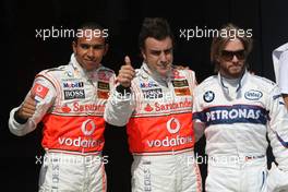 04.08.2007 Budapest, Hungary,  Lewis Hamilton (GBR), McLaren Mercedes with pole postion man Fernando Alonso (ESP), McLaren Mercedes and Nick Heidfeld (GER), BMW Sauber F1 Team - Formula 1 World Championship, Rd 11, Hungarian Grand Prix, Saturday Qualifying