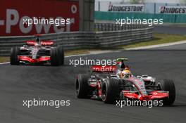 04.08.2007 Budapest, Hungary,  Lewis Hamilton (GBR), McLaren Mercedes, MP4-22 leads Fernando Alonso (ESP), McLaren Mercedes, MP4-22 - Formula 1 World Championship, Rd 11, Hungarian Grand Prix, Saturday Qualifying