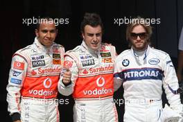 04.08.2007 Budapest, Hungary,  Lewis Hamilton (GBR), McLaren Mercedes with pole postion man Fernando Alonso (ESP), McLaren Mercedes and Nick Heidfeld (GER), BMW Sauber F1 Team - Formula 1 World Championship, Rd 11, Hungarian Grand Prix, Saturday Qualifying