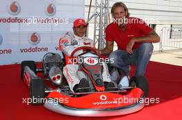 02.08.2007 Budapest, Hungary,  Lewis Hamilton (GBR), McLaren Mercedes with Tamas Kasas (HUN), Water Polo player, Vodafone Karting and opening of shop in Budapest - Formula 1 World Championship, Rd 11, Hungarian Grand Prix, Thursday