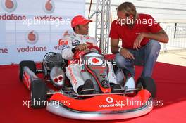 02.08.2007 Budapest, Hungary,  Lewis Hamilton (GBR), McLaren Mercedes with Tamas Kasas (HUN), Water Polo player, Vodafone Karting and opening of shop in Budapest - Formula 1 World Championship, Rd 11, Hungarian Grand Prix, Thursday