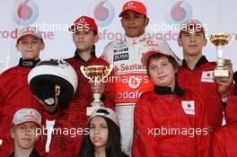 02.08.2007 Budapest, Hungary,  Lewis Hamilton (GBR), McLaren Mercedes with young karters at the Vodafone karting event - Formula 1 World Championship, Rd 11, Hungarian Grand Prix, Thursday