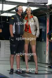 07.09.2007 Monza, Italy,  A girl in the Red Bull Racing garage with a team member - Formula 1 World Championship, Rd 13, Italian Grand Prix, Friday