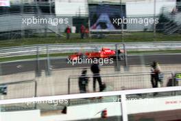 07.09.2007 Monza, Italy,  Kimi Raikkonen (FIN), Räikkönen, Scuderia Ferrari / reflections in the windows of the pit lane building - Formula 1 World Championship, Rd 13, Italian Grand Prix, Friday Practice