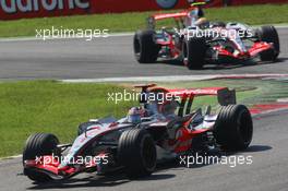 09.09.2007 Monza, Italy,  Fernando Alonso (ESP), McLaren Mercedes, MP4-22 leads Lewis Hamilton (GBR), McLaren Mercedes, MP4-22 - Formula 1 World Championship, Rd 13, Italian Grand Prix, Sunday Race