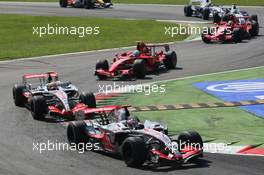 09.09.2007 Monza, Italy,  Fernando Alonso (ESP), McLaren Mercedes, MP4-22 leads Lewis Hamilton (GBR), McLaren Mercedes, MP4-22 and Felipe Massa (BRA), Scuderia Ferrari, F2007 - Formula 1 World Championship, Rd 13, Italian Grand Prix, Sunday Race