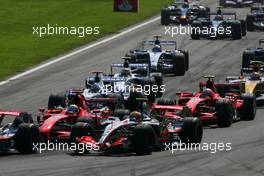 09.09.2007 Monza, Italy,  Lewis Hamilton (GBR), McLaren Mercedes, Felipe Massa (BRA), Scuderia Ferrari at the start - Formula 1 World Championship, Rd 13, Italian Grand Prix, Sunday Race