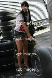 08.09.2007 Monza, Italy,  A girl cleaning tyres in the paddock - Formula 1 World Championship, Rd 13, Italian Grand Prix, Saturday