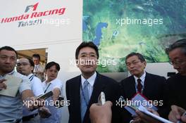 08.09.2007 Monza, Italy,  Dressed in suits, left to right, Satoshi Dobashi, President of Mobilityland corporation and Kazumasa Tsuchiya from Mobilityland - Formula 1 World Championship, Rd 13, Italian Grand Prix, Saturday