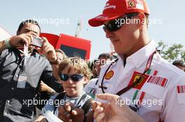 08.09.2007 Monza, Italy,  Michael Schumacher (GER), Scuderia Ferrari, Advisor signs autographs - Formula 1 World Championship, Rd 13, Italian Grand Prix, Saturday