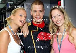 08.09.2007 Monza, Italy,   Mirjam Weichselbraun and Melanie Binder with Sebastian Vettel (GER), Scuderia Toro Rosso - Formula 1 World Championship, Rd 13, Italian Grand Prix, Saturday Qualifying