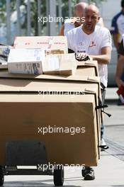 06.09.2007 Monza, Italy,  McLaren Mercedes team member delivers parts to the track - Formula 1 World Championship, Rd 13, Italian Grand Prix, Thursday