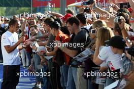 06.09.2007 Monza, Italy, Lewis Hamilton (GBR), McLaren Mercedes signing autographs to the fans - Formula 1 World Championship, Rd 13, Italian Grand Prix, Thursday