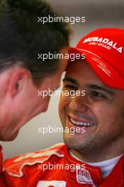 07.12.2007 Jerez, Spain,  Felipe Massa (BRA), Scuderia Ferrari and Michael Schumacher (GER), Test Driver, Scuderia Ferrari, share a joke - Formula 1 Testing, Jerez