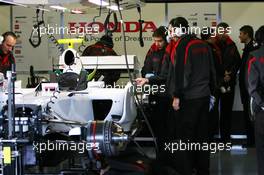04.12.2007 Jerez, Spain,  Ross Brawn (GBR) Team Principal, Honda Racing F1 Team and Nick Fry (GBR), Honda Racing F1 Team, Chief Executive Officer watch at the back of the garage - Formula 1 Testing, Jerez