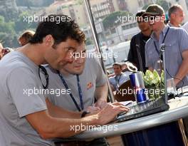 24.05.2007 Monte Carlo, Monaco,  Mark Webber (AUS), Red Bull Racing, at the opening of a charity event to give fans the chance to have their picture on the Red Bull Racing F1 Car, at the British Grand Prix - Formula 1 World Championship, Rd 5, Monaco Grand Prix, Thursday Practice