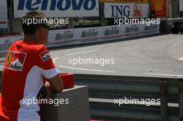 24.05.2007 Monte Carlo, Monaco,  Michael Schumacher (GER), Scuderia Ferrari, Advisor, watches the session from "La Rascasse" corner - Formula 1 World Championship, Rd 5, Monaco Grand Prix, Thursday