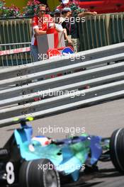 24.05.2007 Monte Carlo, Monaco,  Michael Schumacher (GER), Scuderia Ferrari, Advisor, watches the session from "La Rascasse" corner as Rubens Barrichello (BRA), Honda Racing F1 Team, RA107, drives past  - Formula 1 World Championship, Rd 5, Monaco Grand Prix, Thursday Practice