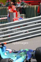 24.05.2007 Monte Carlo, Monaco,  Michael Schumacher (GER), Scuderia Ferrari, Advisor, watches the session from "La Rascasse" corner as Jenson Button (GBR), Honda Racing F1 Team, RA107, drives past  - Formula 1 World Championship, Rd 5, Monaco Grand Prix, Thursday Practice