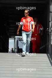 24.05.2007 Monte Carlo, Monaco,  Michael Schumacher (GER), Scuderia Ferrari, Advisor, arrives at the circuit / going to his Team in the Pit Lane - Formula 1 World Championship, Rd 5, Monaco Grand Prix, Thursday