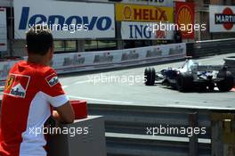 24.05.2007 Monte Carlo, Monaco,  Michael Schumacher (GER), Scuderia Ferrari, Advisor, watches the session from "La Rascasse" corner, passing: Nick Heidfeld (GER), BMW Sauber F1 Team - Formula 1 World Championship, Rd 5, Monaco Grand Prix, Thursday